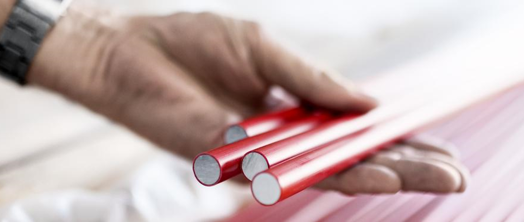 a person holding a red phone