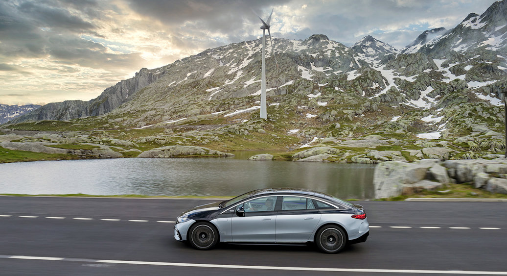 Mercedes-Benz in the mountains with windmill in the background