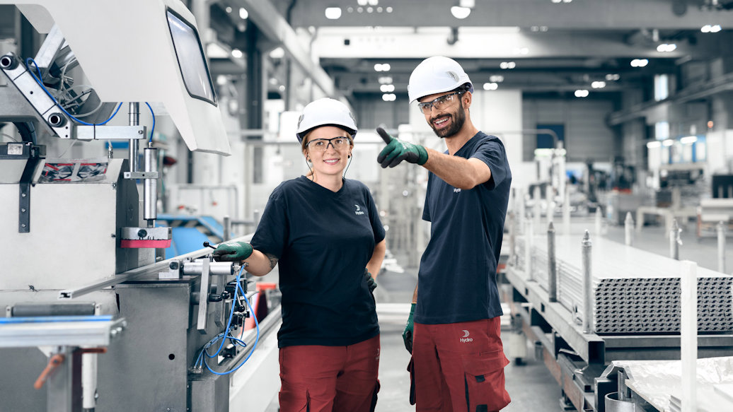 a man and woman wearing hard hats
