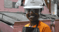 a man wearing a hard hat and safety goggles