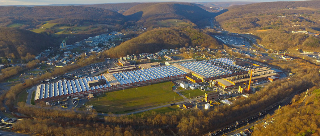 a large building with a parking lot