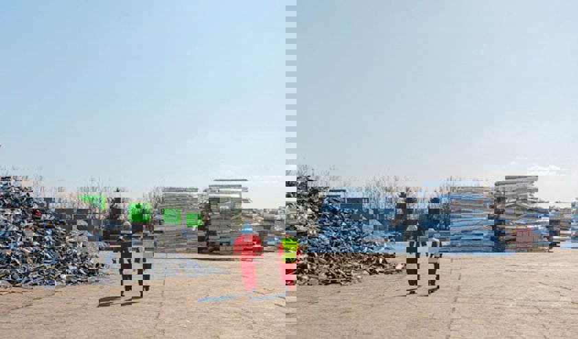 two people walking on a road