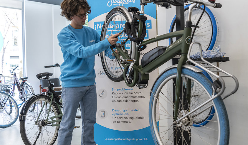 a person standing next to a bicycle