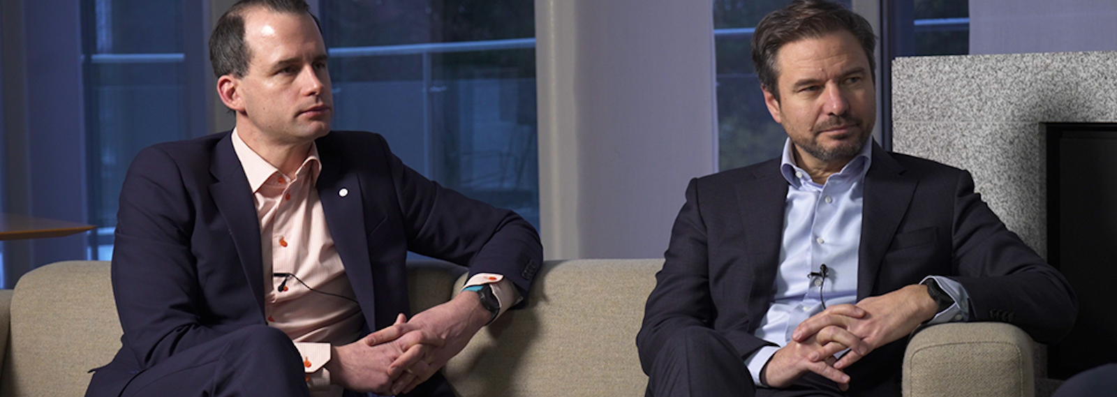 men sitting on a couch