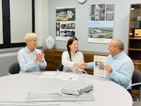 a few people sitting at a table