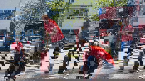 a group of people working on a fire hydrant