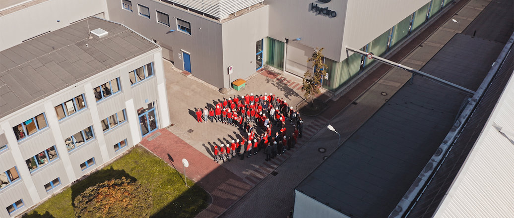a group of people in uniform standing outside a building