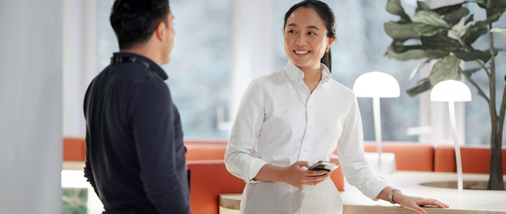 a woman talking to a man