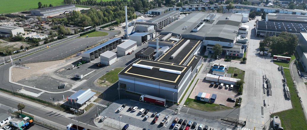 an industrial facility with a parking lot