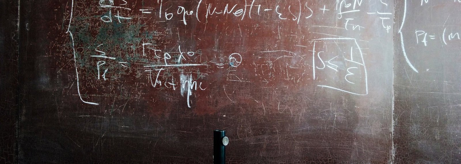 a worn blackboard with science  equations